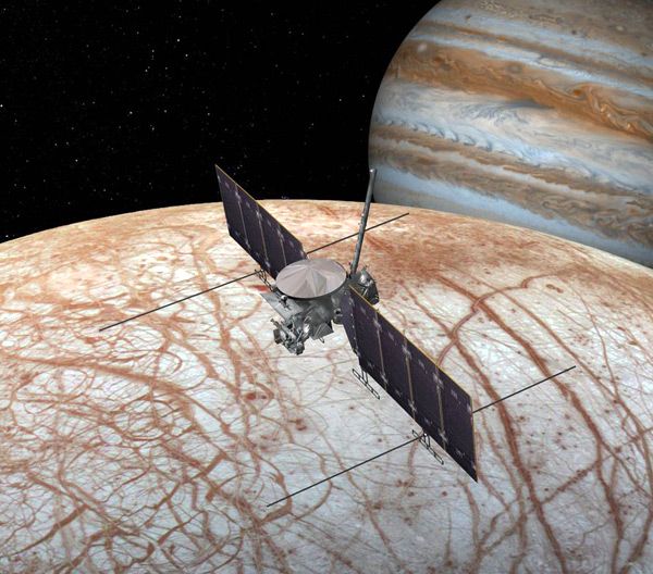 An artist's concept of a NASA spacecraft flying above Jupiter's icy moon Europa.