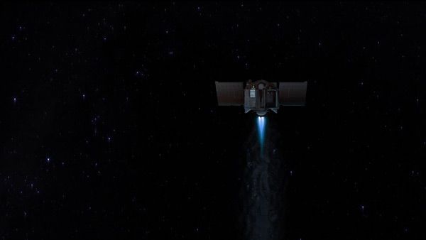 An artist's concept that shows OSIRIS-REx firing its main engines in deep space.