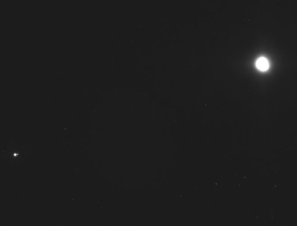 A group photo of the Earth, Moon (both at lower left) and asteroid Bennu (at upper right)...as seen by NASA's OSIRIS-REx spacecraft on December 19, 2018.