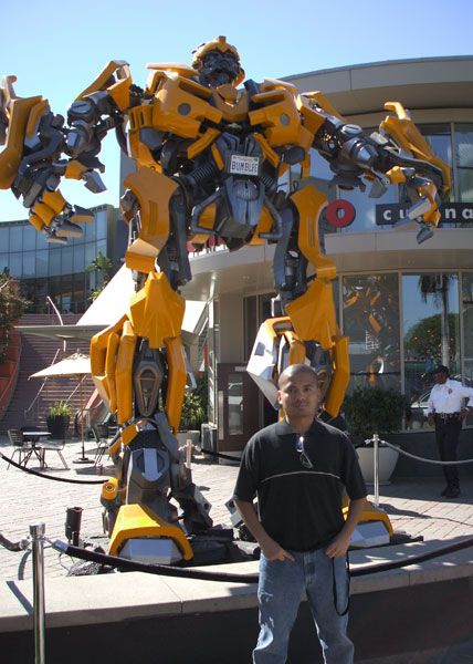 Posing in front of a life-size Bumblebee prop used in the film TRANSFORMERS...on October 19, 2007.