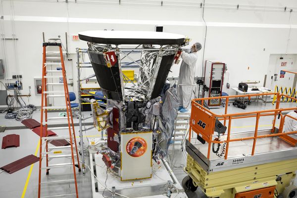 Engineers install the Parker Solar Probe's heat shield inside the Astrotech Space Operations facility in Titusville, Florida...on June 27, 2018.