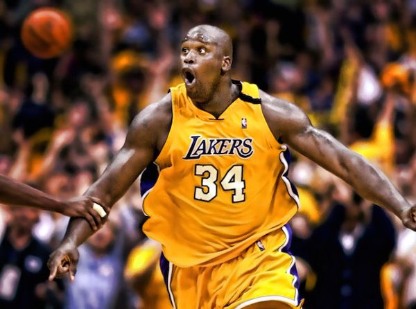 Shaquille O'Neal celebrates after the Lakers defeat the Trailblazers, 89-84, in Game 7 of the Western Conference Finals...on June 4, 2000.