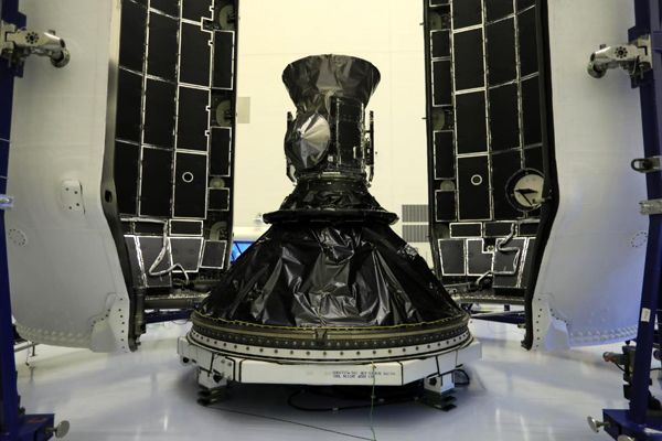 NASA's TESS satellite is about to be encapsulated by the payload fairing for SpaceX's Falcon 9 rocket at Kennedy Space Center in Florida...on April 9, 2018.