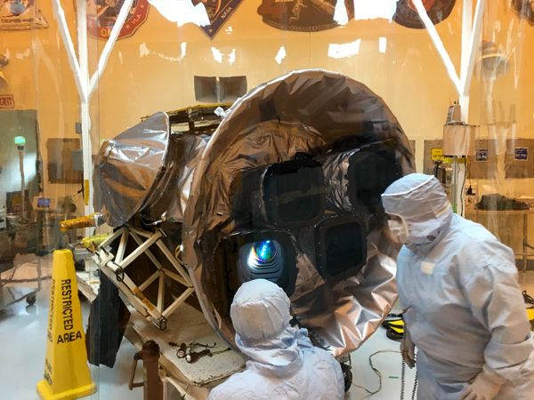 Inside the Payload Hazardous Servicing Facility at Kennedy Space Center in Florida, engineers inspect the four cameras NASA's TESS satellite will use to scour 85 percent of the entire sky for exoplanets.