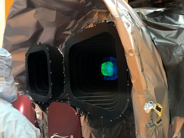 Inside the Payload Hazardous Servicing Facility at Kennedy Space Center in Florida, engineers inspect two of the four cameras NASA's TESS satellite will use to scour 85 percent of the entire sky for exoplanets.