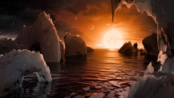 An artist's concept of how the surface of TRAPPIST-1f might look like...with two other planets in the TRAPPIST-1 star system visible in the sky.