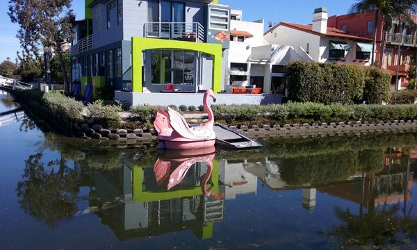 A pink flamingo boat that's docked near a condo in the Venice Canal Historic District...on January 30, 2017.