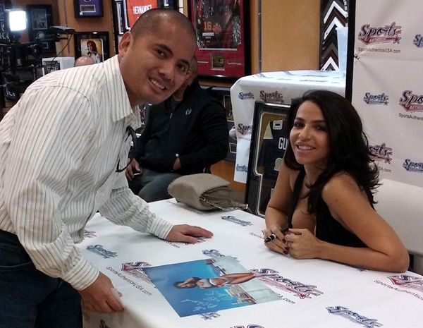 Posing with Vida Guerra inside Sports Authentics USA at Puente Hills Mall...on January 21, 2017.