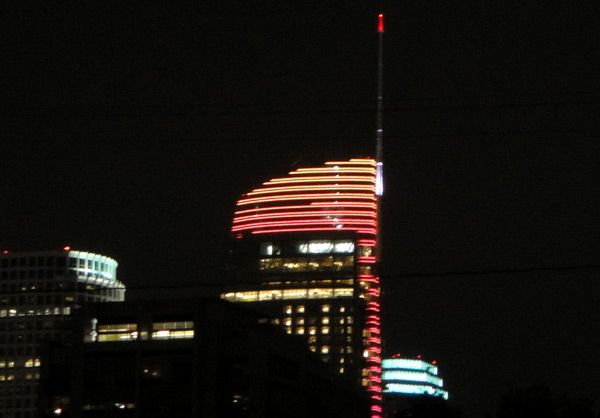 The rooftop sail of the Wilshire Grand Center is lit up in red, orange and yellow to support Los Angeles' bid for the 2024 Summer Olympic Games...on May 10, 2017.