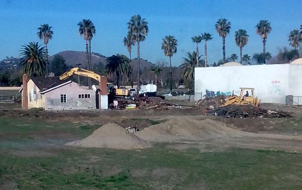 A demolition crew begins tearing down an old abandoned house on a vacant dirt lot behind my home in Pomona, CA...on January 26, 2018.