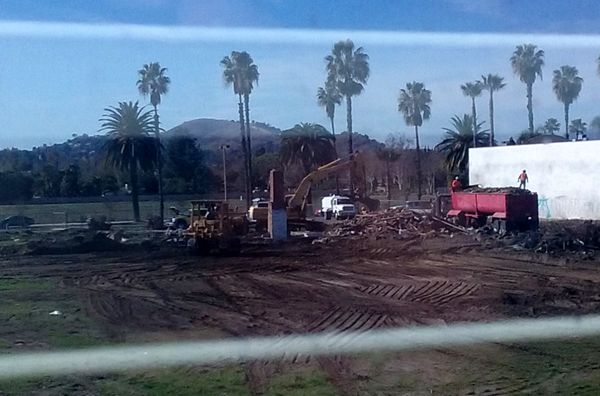 Only one chimney remains, as a demolition crew continues tearing down the old abandoned house on a vacant dirt lot behind my home in Pomona, CA...on January 26, 2018.