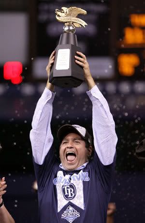 Principal owner of the Tampa Bay Rays, Stuart Sternberg celebrates with the American League Champion's trophy after defeating the Boston Red Sox in game seven of the American League Championship Series during the 2008 MLB playoffs on October 19, 2008 at Tropicana Field in St Petersburg, Florida. The Rays defeated the Red Sox 3-1 to win the series 4-3.