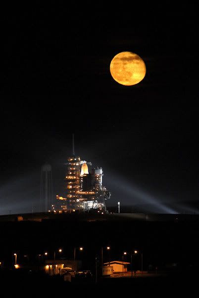 The full moon shines bright high above space shuttle Endeavour as it prepares to launch towards the International Space Station on November 14, 2008.