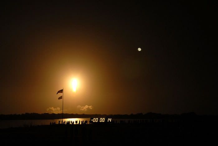 The full moon provides a backdrop as space shuttle Endeavour soars into the night sky on flight STS-126 on November 14, 2008.