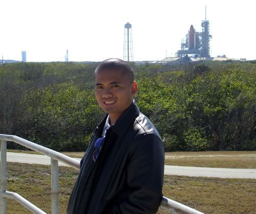 Posing in front of space shuttle Discovery on its pad at Kennedy Space Center's Launch Complex 39A in Florida...on February 9, 2009.