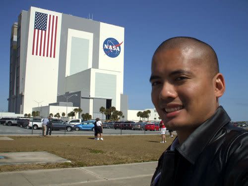 Posing in front of the Vehicle Assembly Building at Kennedy Space Center.