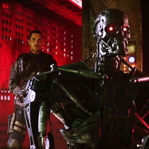 John Connor (Christian Bale) sneaks up on a cyborg in TERMINATOR SALVATION...out in theaters on May 22.