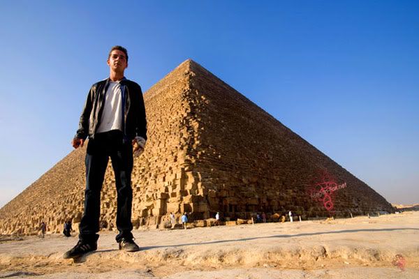 Shia LaBeouf posing in front of an Egyptian pyramid.