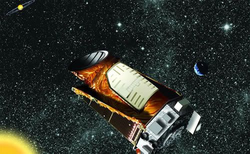 An artist's concept of the Kepler telescope in space.