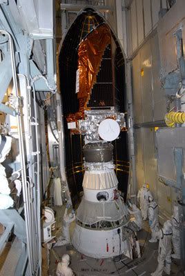At Cape Canaveral Air Force Station in Florida, technicians prepare to install the Delta II rocket's payload fairing around the KEPLER spacecraft (2/26/09).