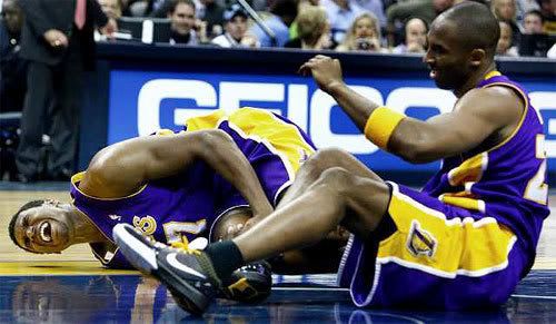 Kobe Bryant watches as Andrew Bynum writhes in pain on the floor, after the two collide during the game against the Memphis Grizzlies on January 31, 2009.