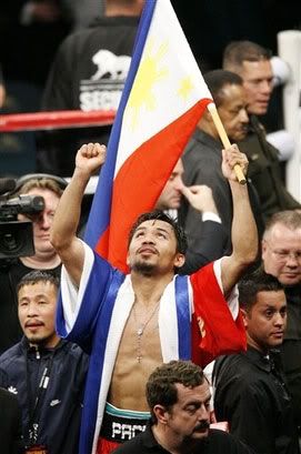 Manny Pacquiao celebrates after beating Oscar De La Hoya by TKO after the 8th round on December 6, 2008, at the MGM Grand Hotel in Las Vegas.
