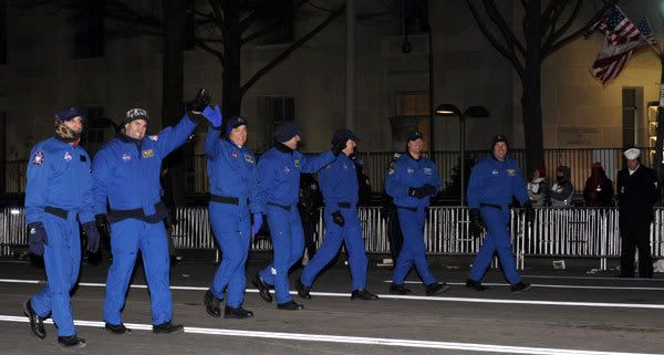 The 7-member crew of space shuttle flight STS-126 wave to the crowd during last night's Inaugural Parade in Washington, D.C.