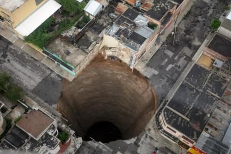 A giant sinkhole emerges in Guatemala City on May 31, 2010.