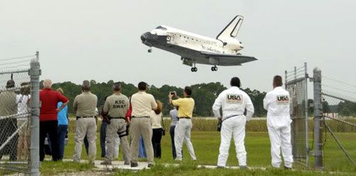 Space shuttle Discovery touches down at the Kennedy Space Center in Florida following a 13-day mission to the International Space Station.