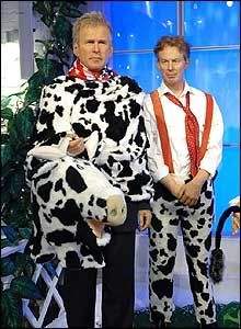 British Prime Minister Tony Blair and US President George Bush star as a pantomime cow.