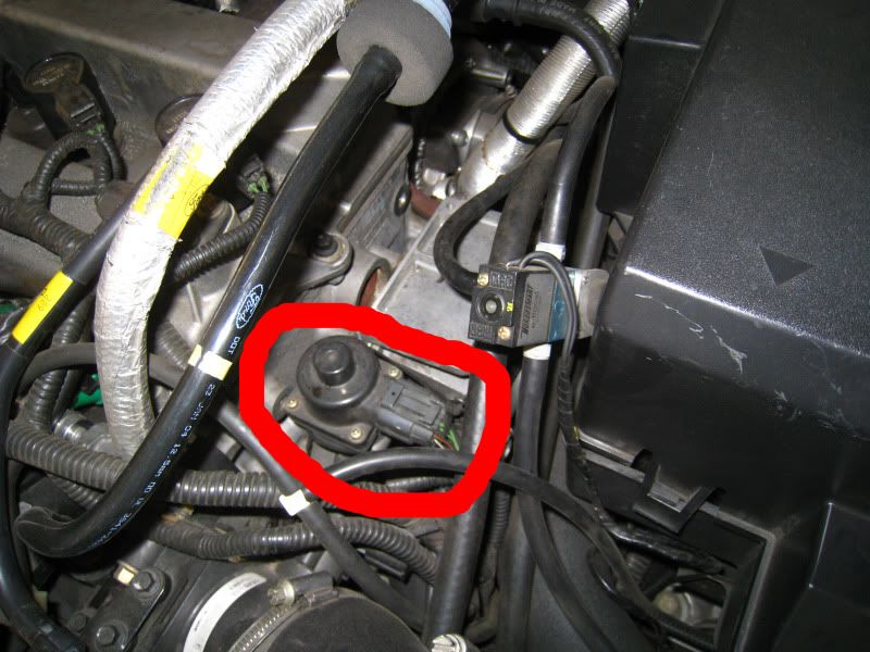 Where is the location of a car's thermostat?