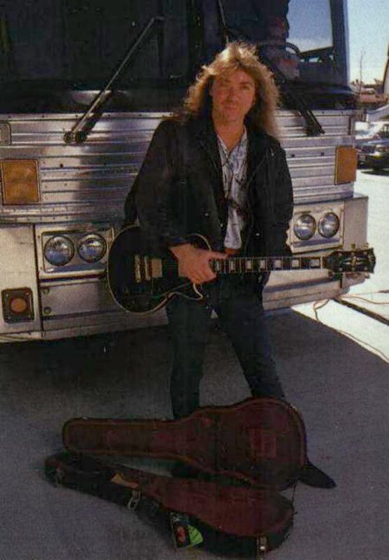 DaveWithGuitarInFrontOfBus.jpg