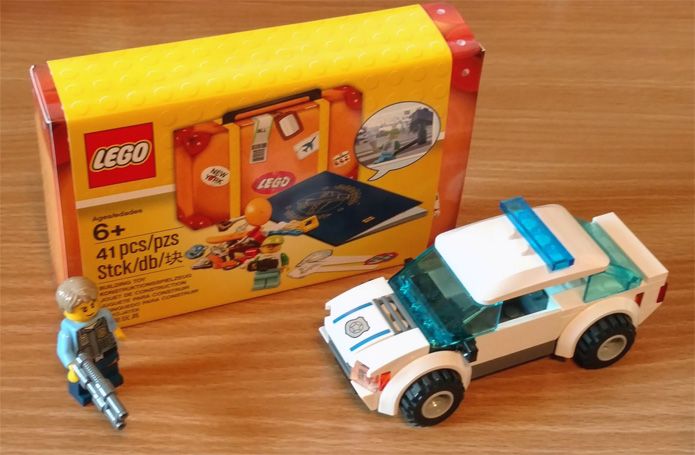 "Suitcase" with police car and minifig for scale.