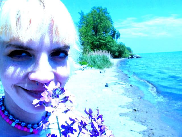 smelling the flowers on the edge of lake michigan