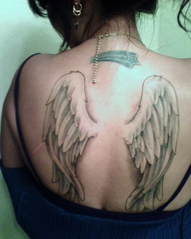 small angel tattoos .