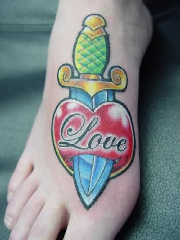 piercing foot tattoo