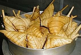 Ketupat pulut in palas leaf.