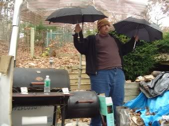 Hiroshi holds umbrellas