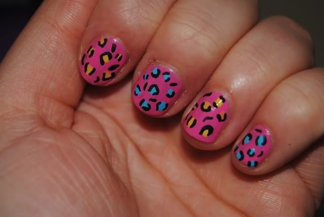 Next, outline the 'splodges' with either a black nail art pen or black 