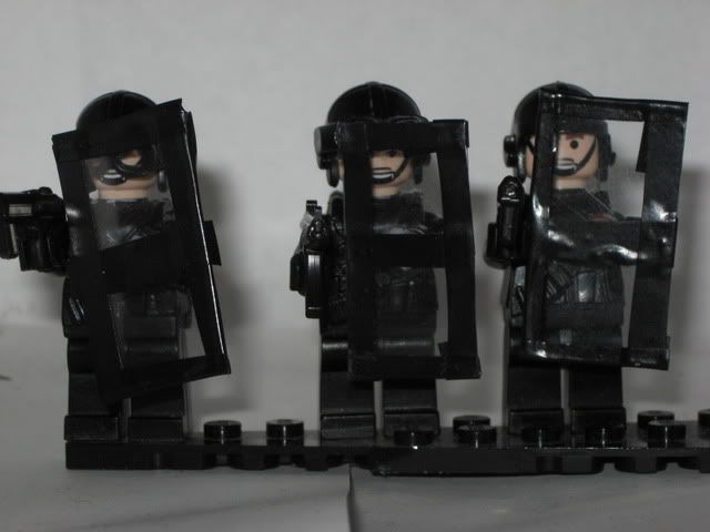 Some SWAT officers ready for action To get a better look at the shield and