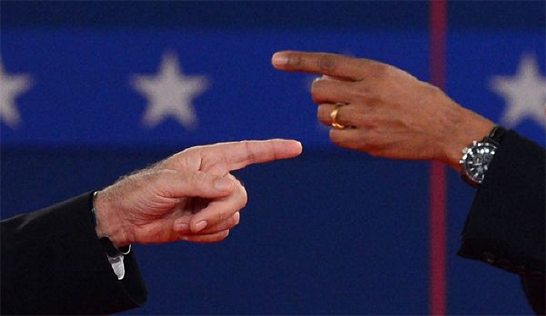 an image of the two candidates' hands, pointing at each other