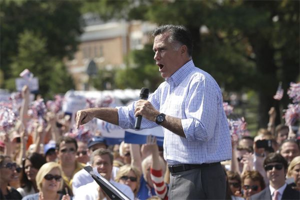 image of Mitt Romney at a campaign event, bellowing onstage