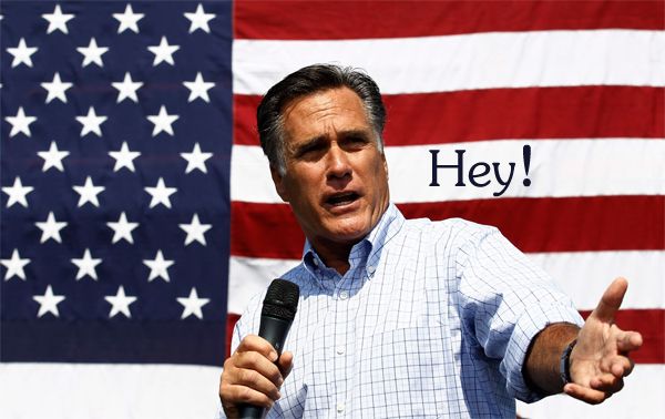 image of Mitt Romney standing in front of a giant flag holding a microphone, to which I have added text indicating he's saying 'Hey!' indignantly