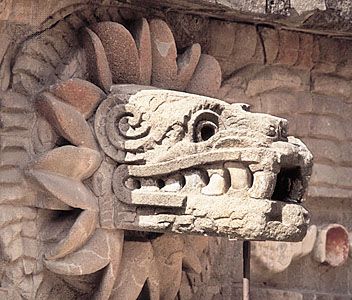 image of a stone carving of the Mexican deity Quetzalcoatl, a winged serpent