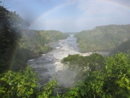 image of a rainbow over the Victoria Nile, with white water rapids