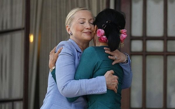 image of Hillary Clinton with Myanmar's pro-democracy opposition leader, Aung San Suu Kyi, a thin Asian woman; they are hugging each other tightly