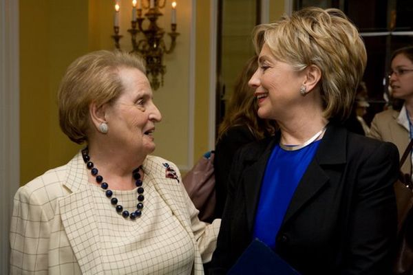image of Hillary Clinton standing next to former Secretary of State Madeleine Albright, an in-betweenie older white woman; they are turned toward each other and smiling