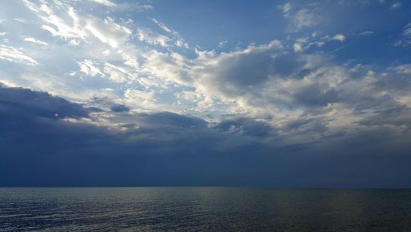 image of the lake with gathering clouds above