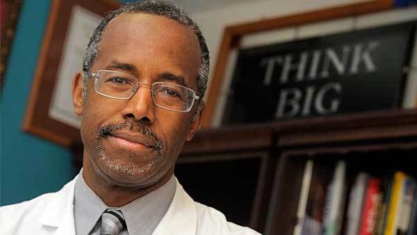 image of Dr. Ben Carson, a middle-aged black man, standing in front of a sign reading 'Think Big'