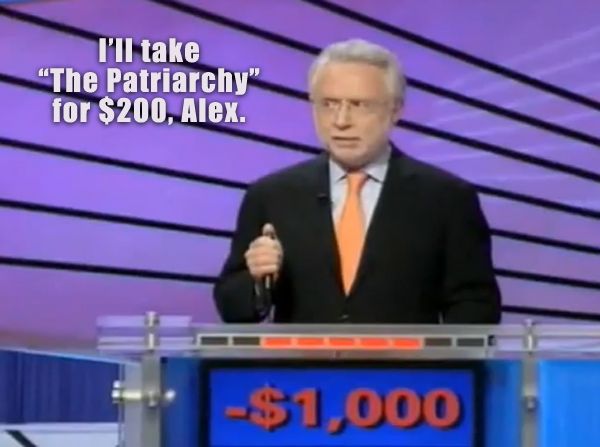 image of Wolf Blitzer during the celebrity Jeopardy tournament with -$1,000 and a confused look on his face, to which I've added text reading: 'I'll take 'The Patriarchy' for $200, Alex.'